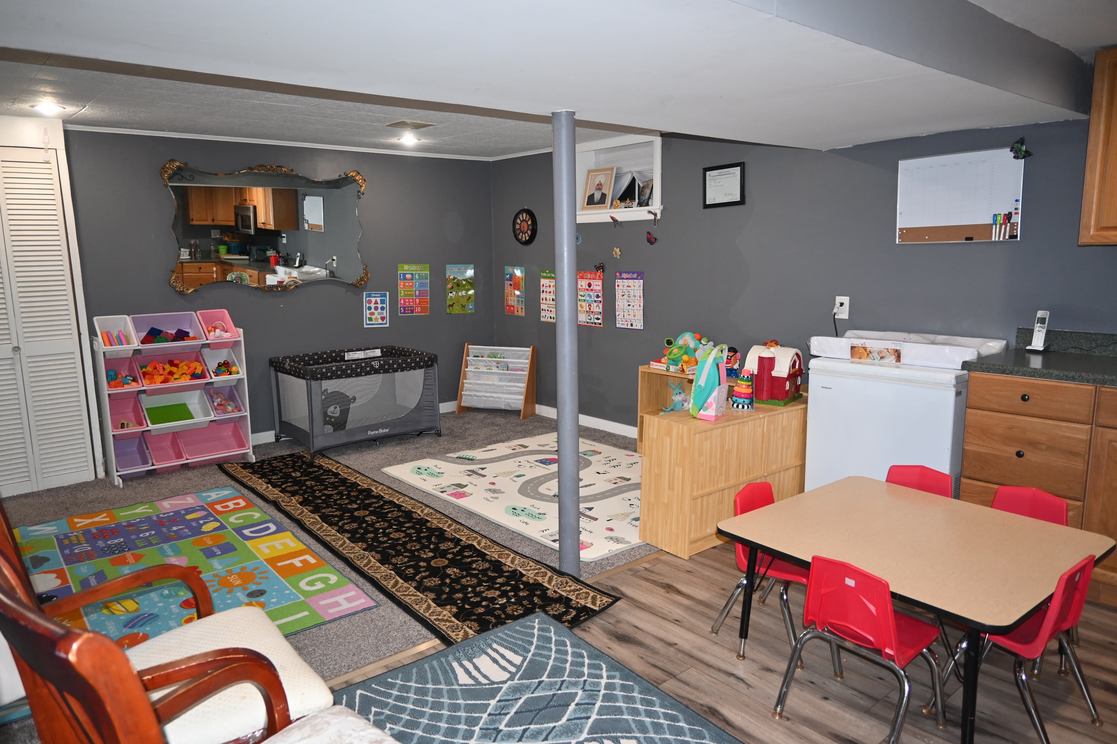 Bright daycare playroom with toys and learning materials